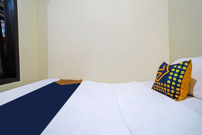 Imagen de la habitación del Hotel SPOT ON 91783 Urban Syariah Residence. Foto 8
