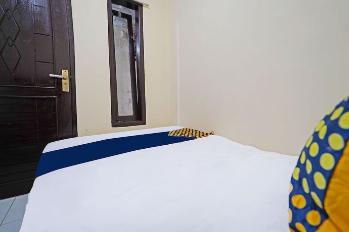 Imagen de la habitación del Hotel SPOT ON 91783 Urban Syariah Residence. Foto 11