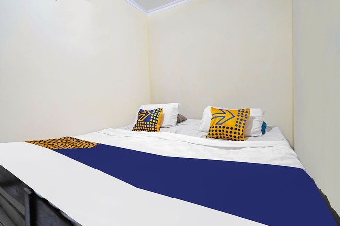 Imagen de la habitación del Hotel SPOT ON 91783 Urban Syariah Residence. Foto 12