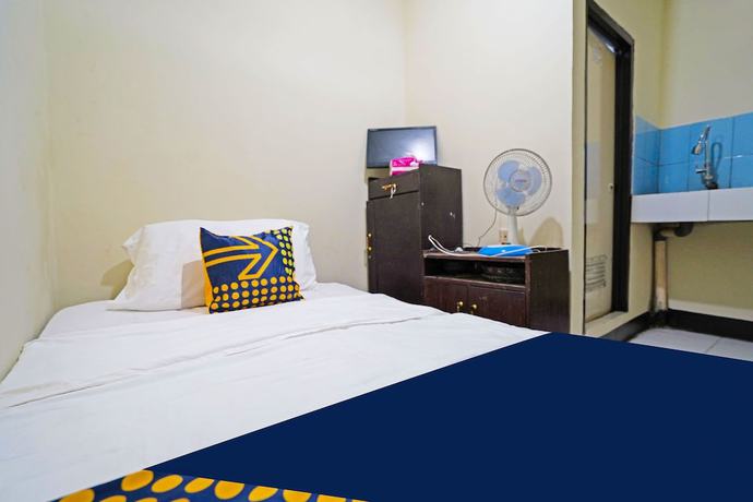 Imagen de la habitación del Hotel SPOT ON 91783 Urban Syariah Residence. Foto 13