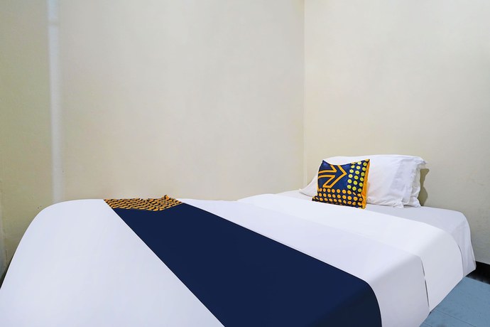 Imagen de la habitación del Hotel SPOT ON 91783 Urban Syariah Residence. Foto 14