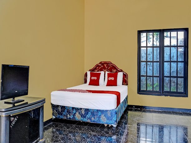 Imagen de la habitación del Hotel SPOT ON 91798 Grand Mutiara. Foto 4