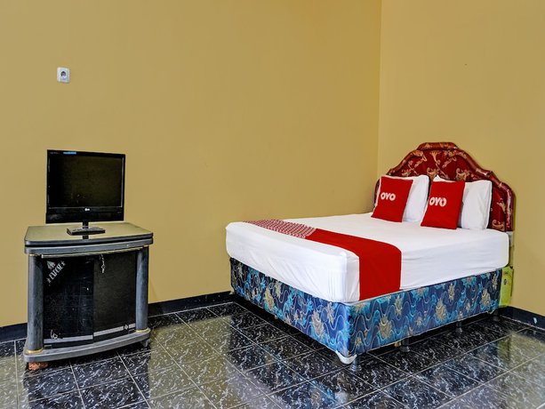 Imagen de la habitación del Hotel SPOT ON 91798 Grand Mutiara. Foto 10
