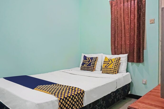 Imagen de la habitación del Hotel SPOT ON 91860 Amazon Homestay Syariah 2. Foto 17