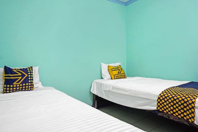 Imagen de la habitación del Hotel SPOT ON 91860 Amazon Homestay Syariah 2. Foto 18