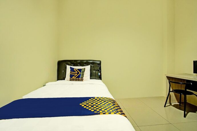 Imagen de la habitación del Hotel SPOT ON 91890 Kost Kalasan Syariah. Foto 17