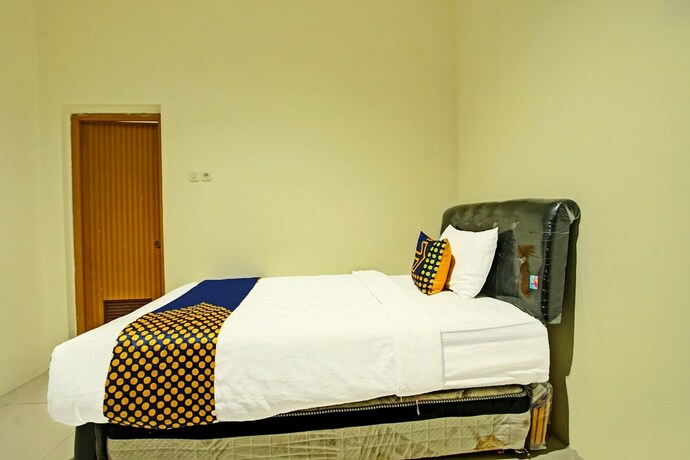 Imagen de la habitación del Hotel SPOT ON 91890 Kost Kalasan Syariah. Foto 20