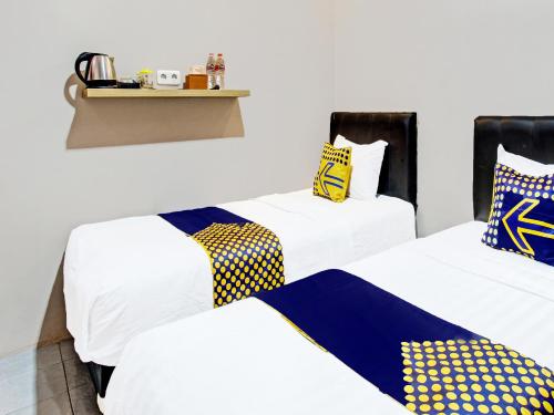 Imagen de la habitación del Hotel SPOT ON 91932 Guest House Mustika Syariah. Foto 19