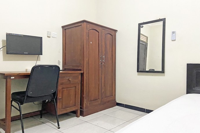 Imagen de la habitación del Hotel SPOT ON 92042 Sumber Rejo Homestay. Foto 5