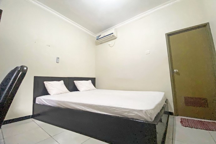 Imagen de la habitación del Hotel SPOT ON 92042 Sumber Rejo Homestay. Foto 7