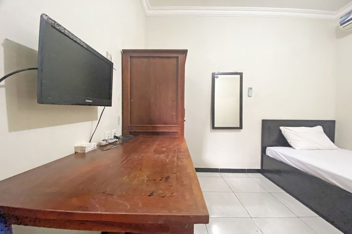 Imagen de la habitación del Hotel SPOT ON 92042 Sumber Rejo Homestay. Foto 9