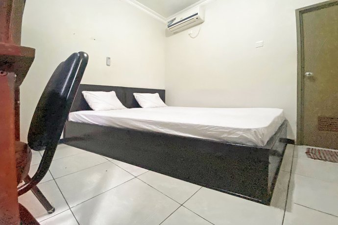Imagen de la habitación del Hotel SPOT ON 92042 Sumber Rejo Homestay. Foto 10
