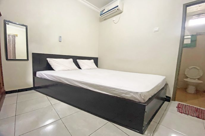 Imagen de la habitación del Hotel SPOT ON 92042 Sumber Rejo Homestay. Foto 12