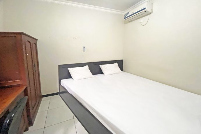 Imagen de la habitación del Hotel SPOT ON 92042 Sumber Rejo Homestay. Foto 13