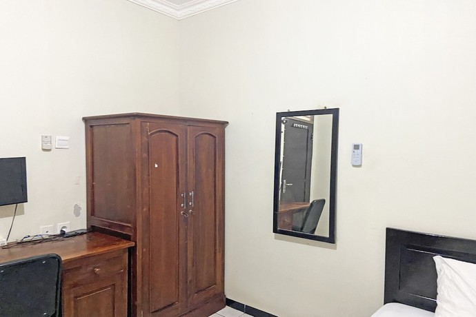 Imagen de la habitación del Hotel SPOT ON 92042 Sumber Rejo Homestay. Foto 14