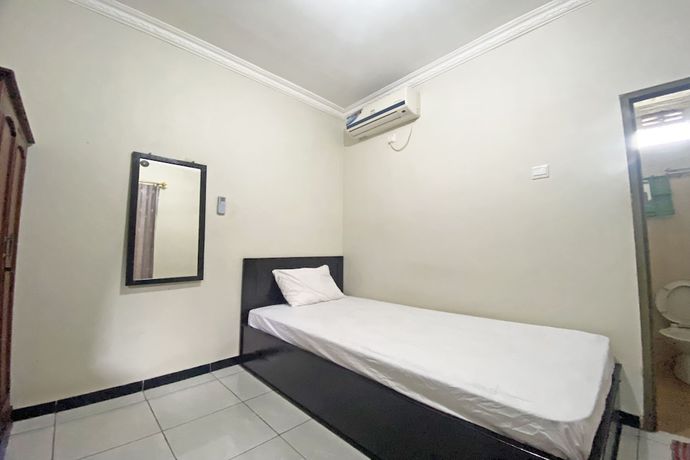 Imagen de la habitación del Hotel SPOT ON 92042 Sumber Rejo Homestay. Foto 16