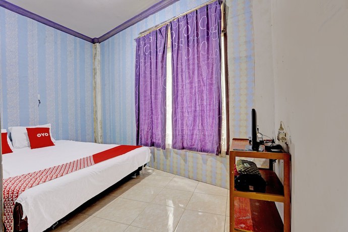 Imagen de la habitación del Hotel SPOT ON 92208 Andira Syariah. Foto 11