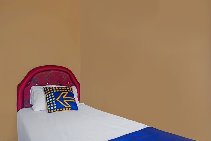 Imagen de la habitación del Hotel SPOT ON 92212 Penginapan Berkah Mandiri Syariah. Foto 8