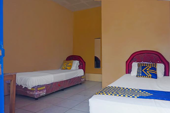 Imagen de la habitación del Hotel SPOT ON 92212 Penginapan Berkah Mandiri Syariah. Foto 10