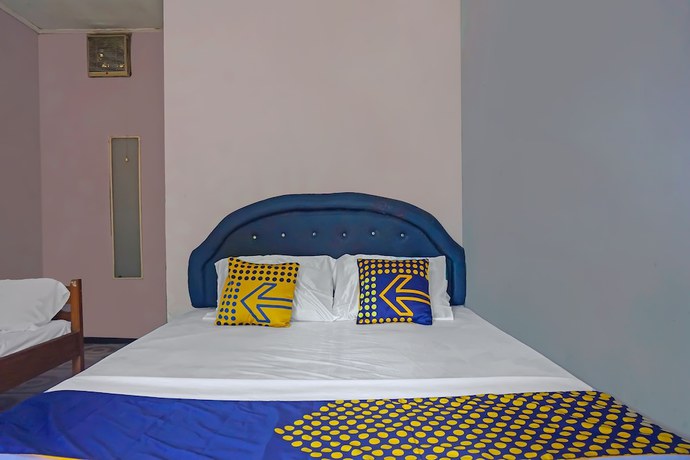 Imagen de la habitación del Hotel SPOT ON 92212 Penginapan Berkah Mandiri Syariah. Foto 11