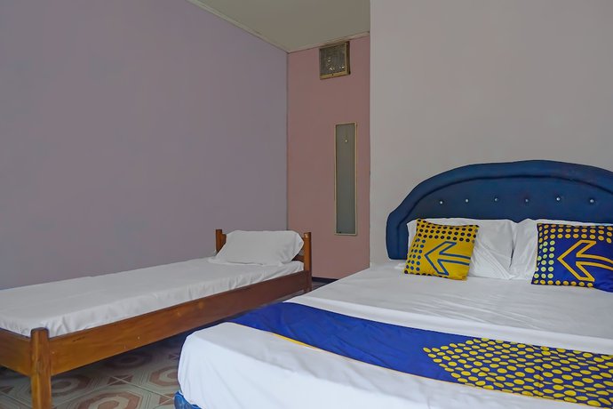 Imagen de la habitación del Hotel SPOT ON 92212 Penginapan Berkah Mandiri Syariah. Foto 12