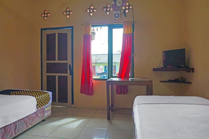 Imagen de la habitación del Hotel SPOT ON 92212 Penginapan Berkah Mandiri Syariah. Foto 13