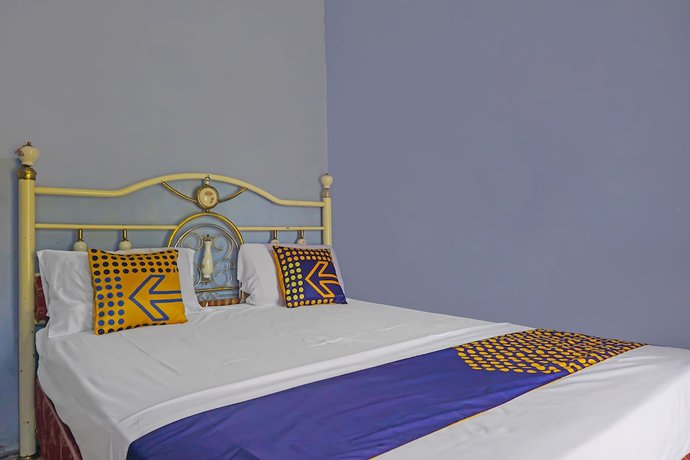 Imagen de la habitación del Hotel SPOT ON 92212 Penginapan Berkah Mandiri Syariah. Foto 15