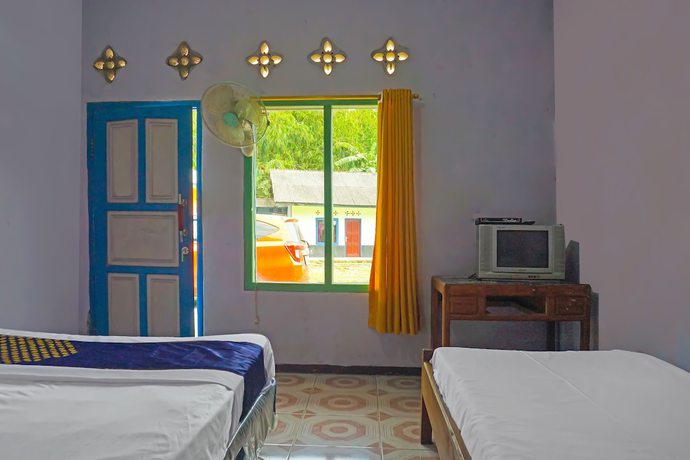 Imagen de la habitación del Hotel SPOT ON 92212 Penginapan Berkah Mandiri Syariah. Foto 17