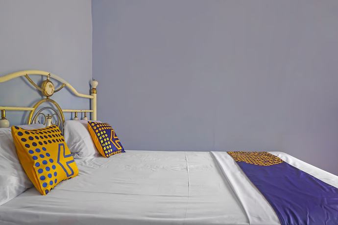 Imagen de la habitación del Hotel SPOT ON 92212 Penginapan Berkah Mandiri Syariah. Foto 18