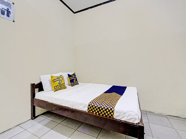 Imagen de la habitación del Hotel SPOT ON 92220 Sari Laut. Foto 19