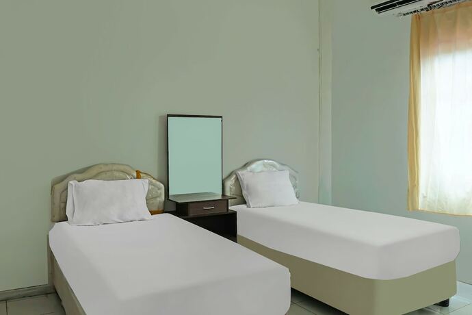 Imagen de la habitación del Hotel SPOT ON 92390 Wilma Kost Syariah. Foto 16