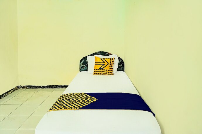 Imagen de la habitación del Hotel SPOT ON 92400 Dhaha Penginapan House Syariah. Foto 19