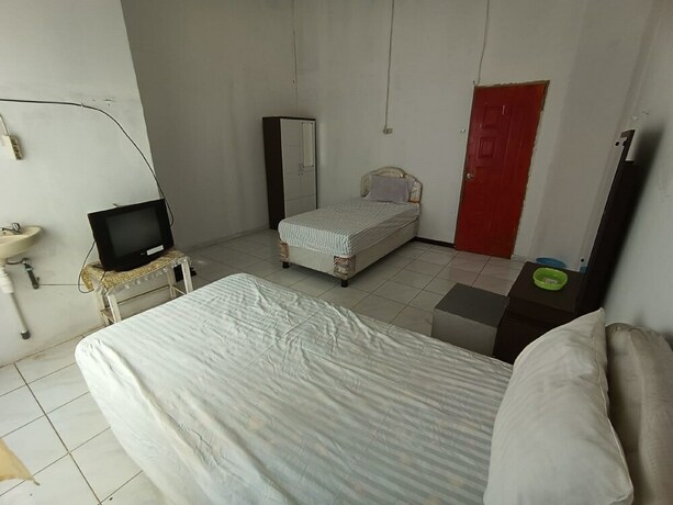 Imagen de la habitación del Hotel SPOT ON 92458 Azeela Kost Syariah. Foto 20