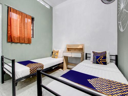 Imagen de la habitación del Hotel SPOT ON 92490 Casa Homestay Syariah. Foto 19