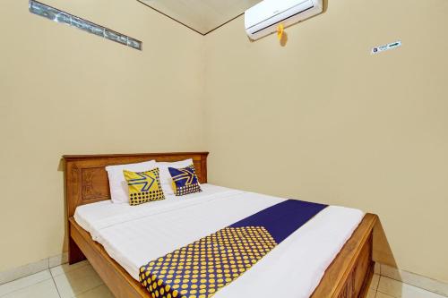 Imagen de la habitación del Hotel SPOT ON 92515 Timoti Guest House. Foto 20