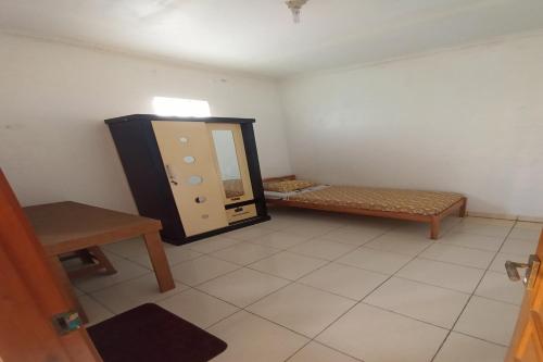 Imagen de la habitación del Hotel SPOT ON 92532 Penginapan Hj Lilis Syariah. Foto 19