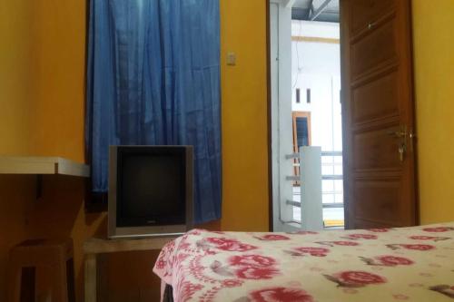 Imagen de la habitación del Hotel SPOT ON 92532 Penginapan Hj Lilis Syariah. Foto 20