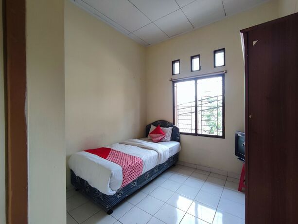 Imagen de la habitación del Hotel SPOT ON 92645 Nita Residence Syariah. Foto 13