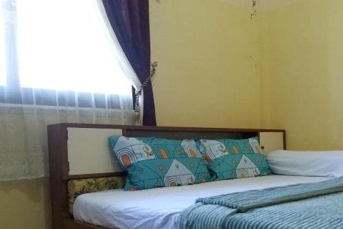 Imagen de la habitación del Hotel SPOT ON 92760 Global Media Homestay Syariah. Foto 19