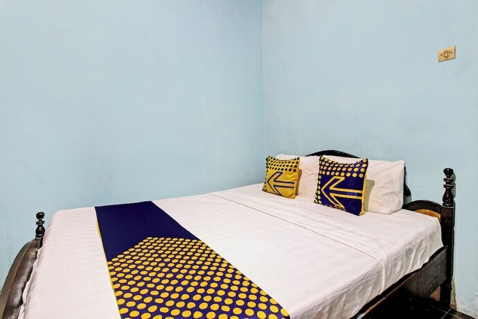 Imagen de la habitación del Hotel SPOT ON 92763 Melati Sukoasih. Foto 17