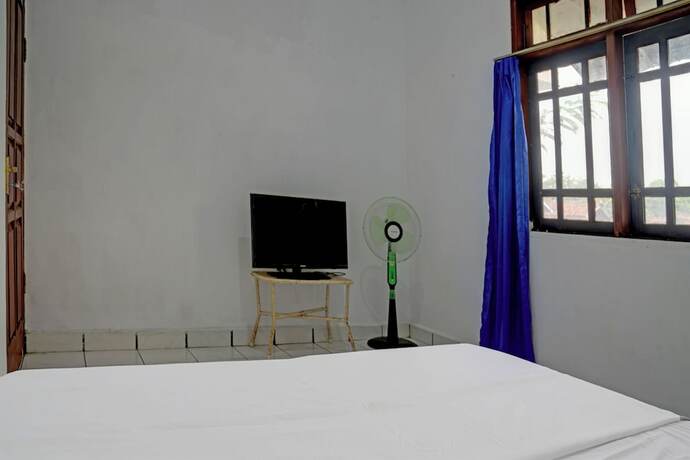 Imagen de la habitación del Hotel SPOT ON 92856 Home Stay Syariah Aom Kusman. Foto 20