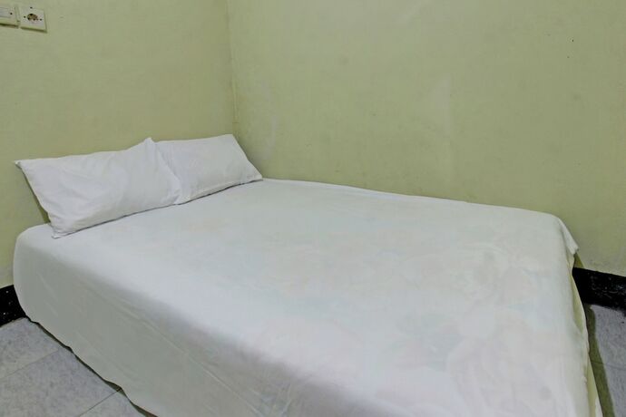 Imagen de la habitación del Hotel SPOT ON 92882 Penginapan 3 Bersaudara. Foto 19