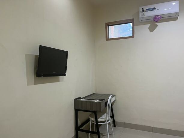 Imagen de la habitación del Hotel SPOT ON 93022 Anugrah Homestay Syariah. Foto 19