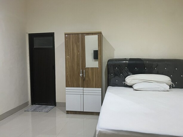 Imagen de la habitación del Hotel SPOT ON 93022 Anugrah Homestay Syariah. Foto 20