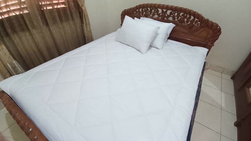 Imagen de la habitación del Hotel SPOT ON 93376 Roemah Ambarrukma 185 Syariah. Foto 17