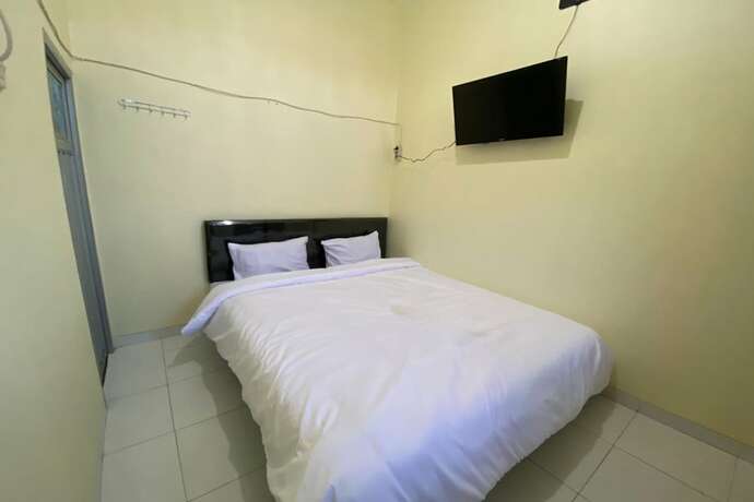 Imagen de la habitación del Hotel SPOT ON 93452 Wulan Homestay 2 Syariah. Foto 12