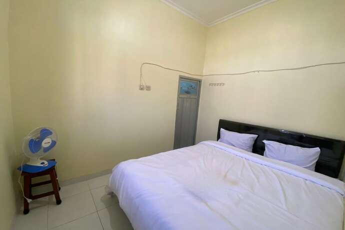 Imagen de la habitación del Hotel SPOT ON 93452 Wulan Homestay 2 Syariah. Foto 13