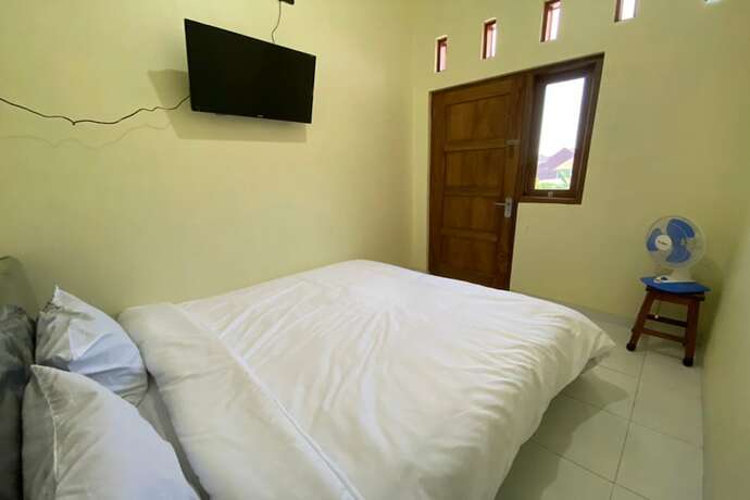 Imagen de la habitación del Hotel SPOT ON 93452 Wulan Homestay 2 Syariah. Foto 14