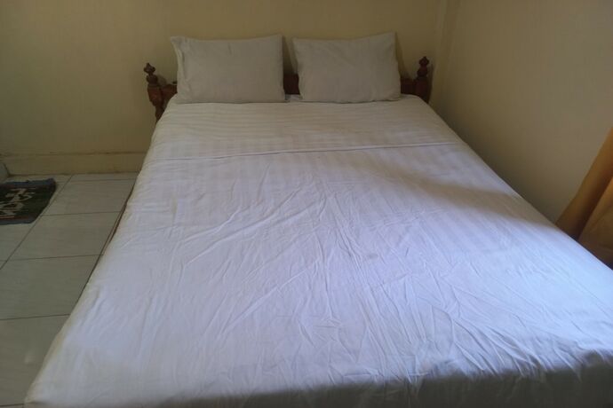 Imagen de la habitación del Hotel SPOT ON 93542 Suripah Kostel Syariah. Foto 19