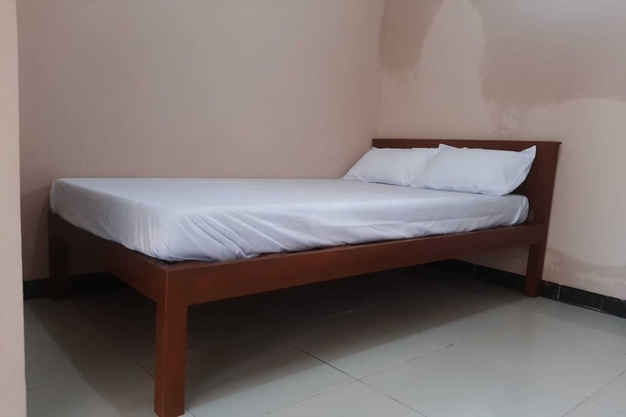 Imagen de la habitación del Hotel SPOT ON 93597 Syagita Kos and Penginapan Syariah. Foto 6